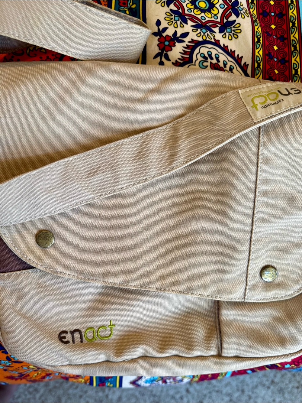 Kathmandu cream canvas tote with lime green logo tag